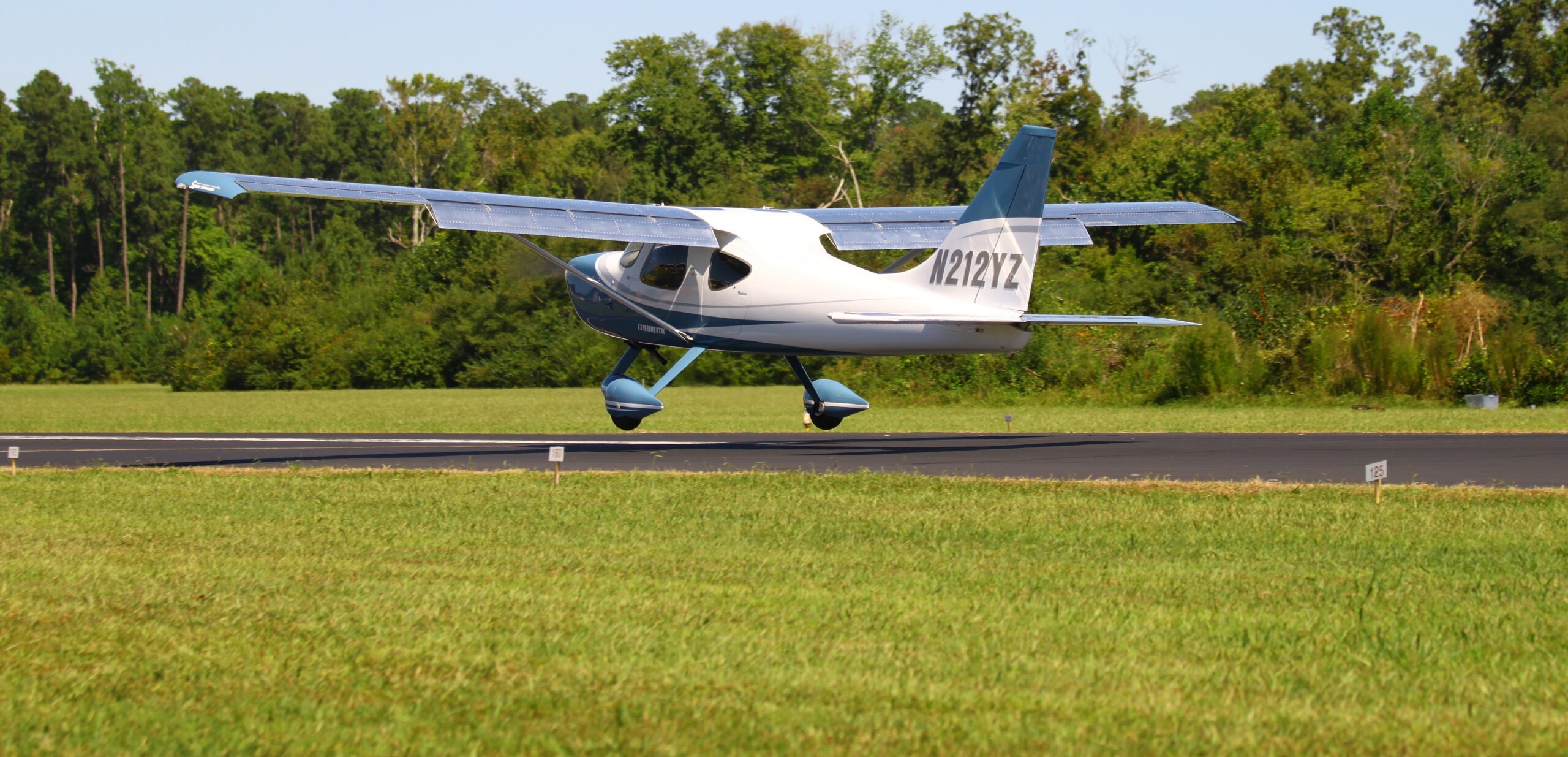 An experimental airplane lifts off during the annual Wings, Wheels, and Keels show at Hummel Field in Middlesex, VA.